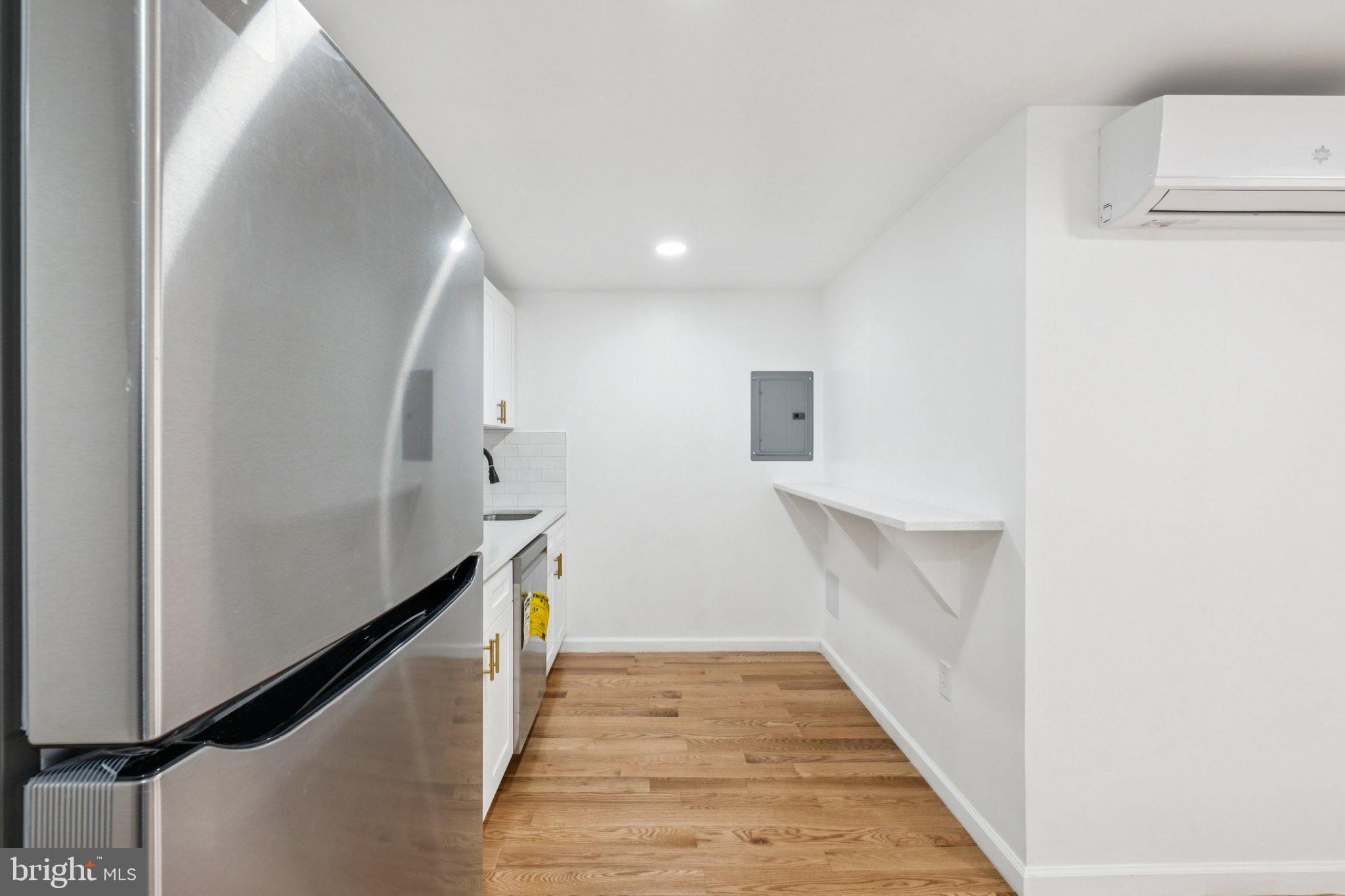 1223 Spruce Street, Unit 3F Philadelphia, PA 19107 - Photo 7 of 37 a view of a hallway with wooden floor