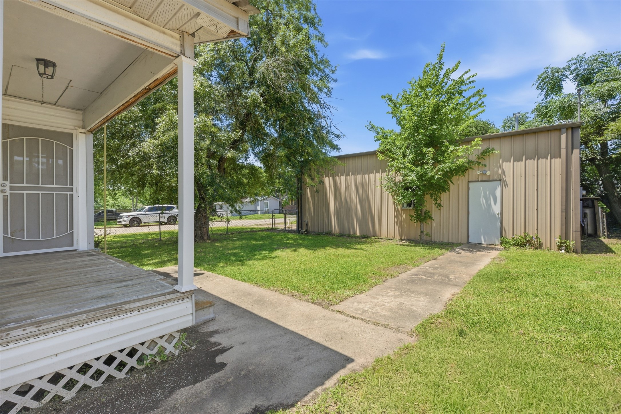 1310 Brazos Street Hempstead, TX 77445 - Photo 23 of 32 a view of a yard with porch and garden