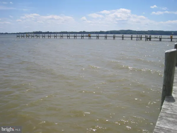 a view of a house with backyard and porch