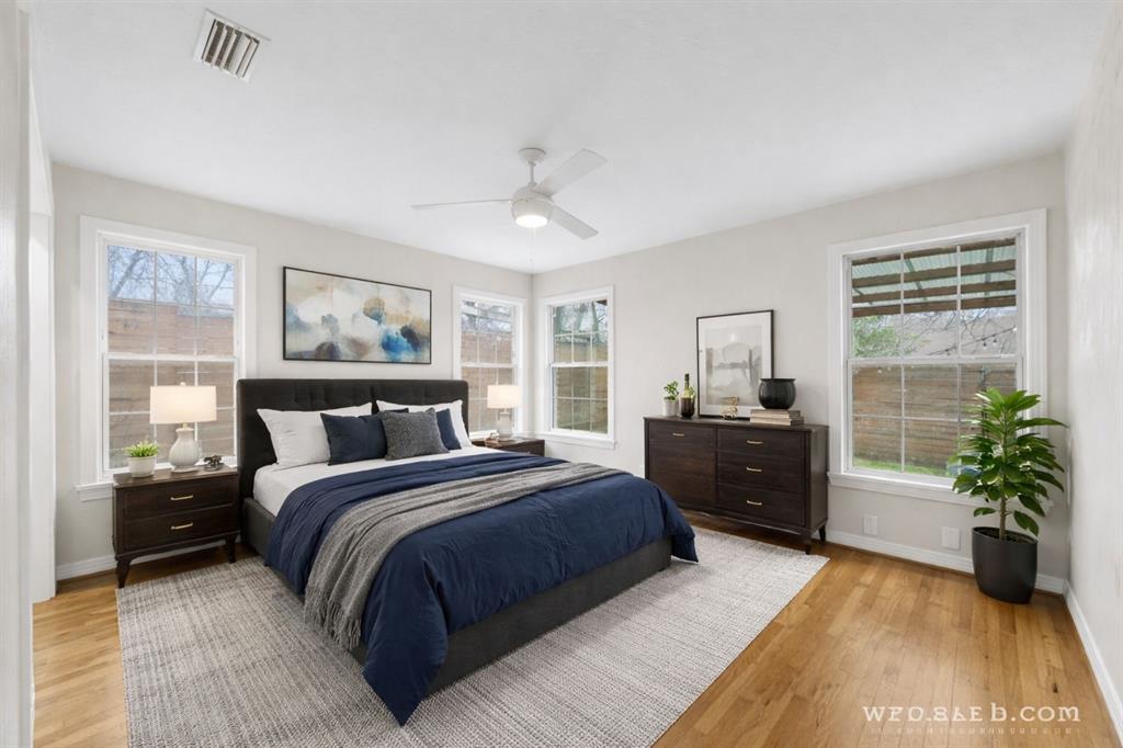 311 North Tennant Street Dallas, TX 75208 - Photo 18 of 23 a bedroom with a large bed and a couch