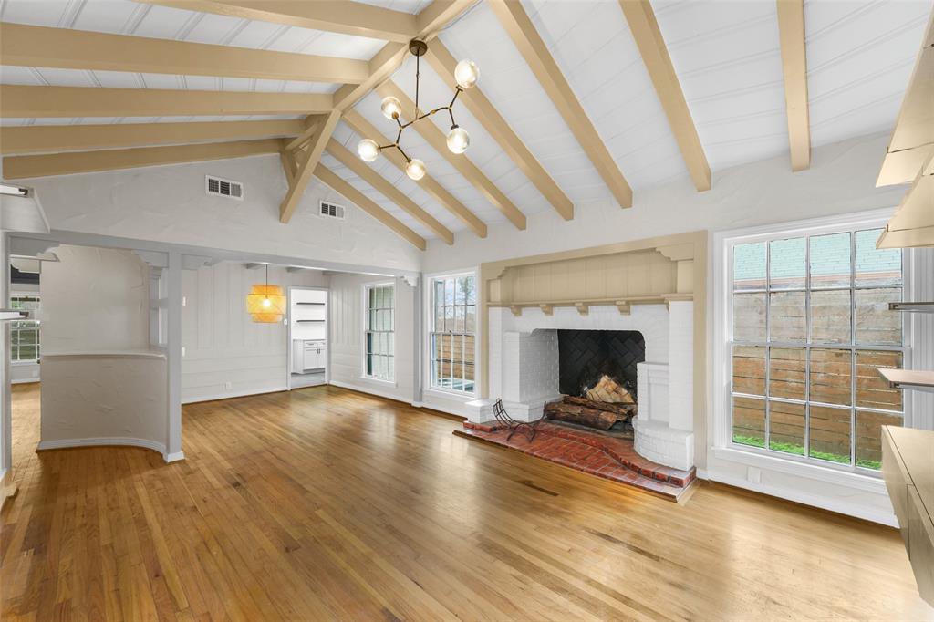311 North Tennant Street Dallas, TX 75208 - Photo 6 of 23 a view of a livingroom with wooden floor and a fireplace