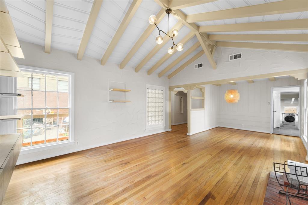 311 North Tennant Street Dallas, TX 75208 - Photo 8 of 23 a view of empty room with wooden floor and fan