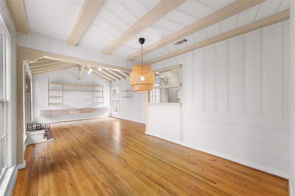 311 North Tennant Street Dallas, TX 75208 - Photo 9 of 23 a view of empty room with wooden floor and fan