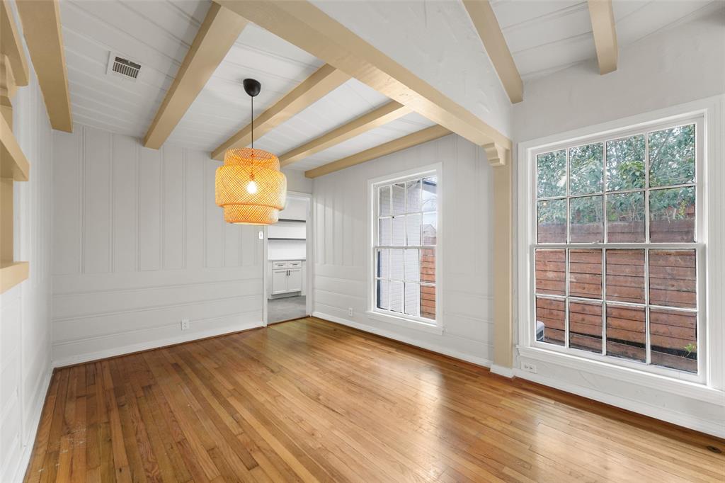 311 North Tennant Street Dallas, TX 75208 - Photo 10 of 23 a view of empty room with wooden floor and fan