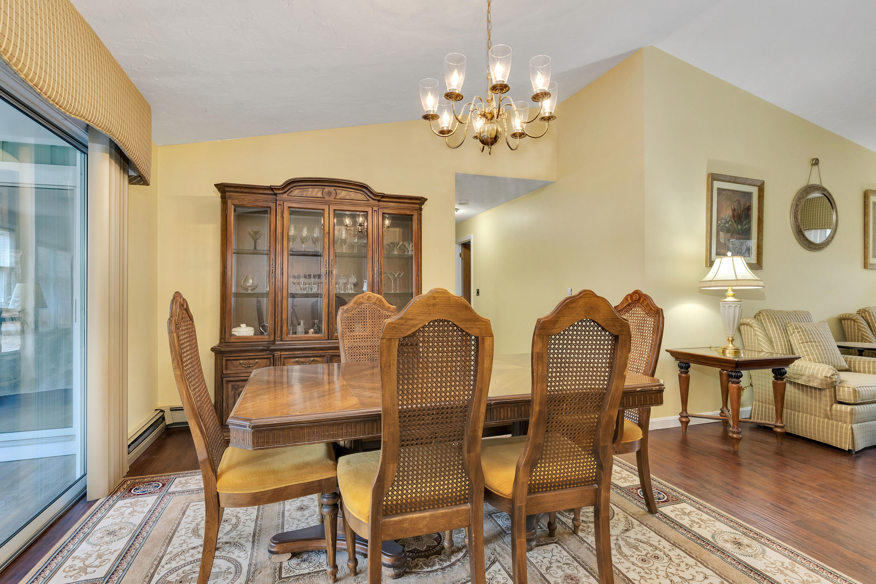 140 Thistle Drive Centerville, MA 02632 - Photo 12 of 46 a view of a dining room with furniture and chandelier