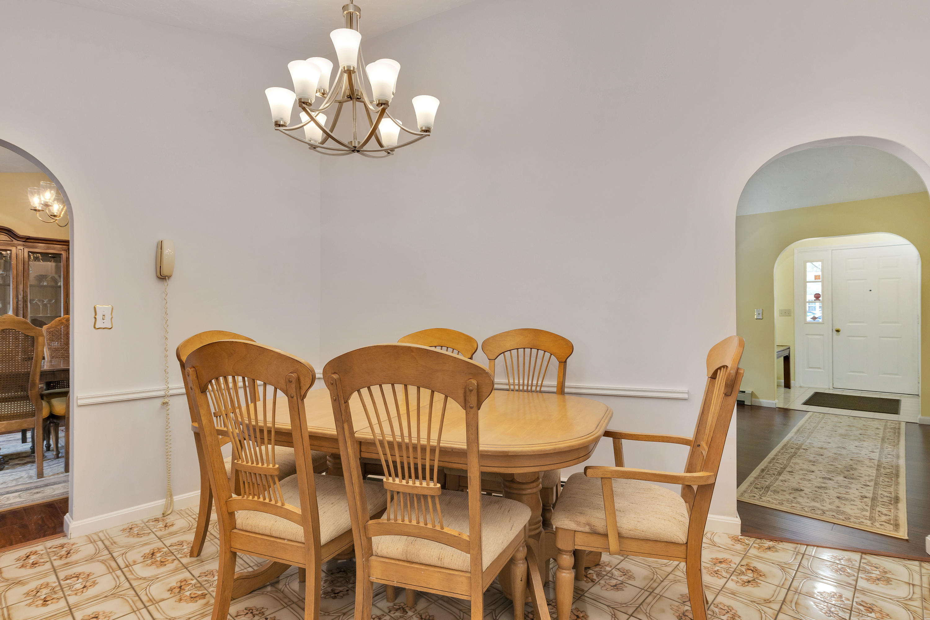 140 Thistle Drive Centerville, MA 02632 - Photo 13 of 46 a view of a dining room with furniture and chandelier