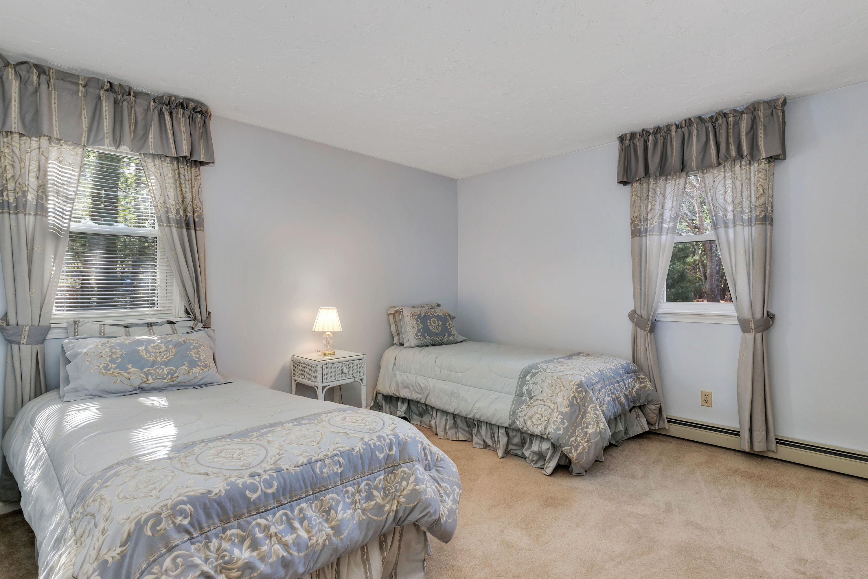 140 Thistle Drive Centerville, MA 02632 - Photo 24 of 46 a bedroom with two beds and large window