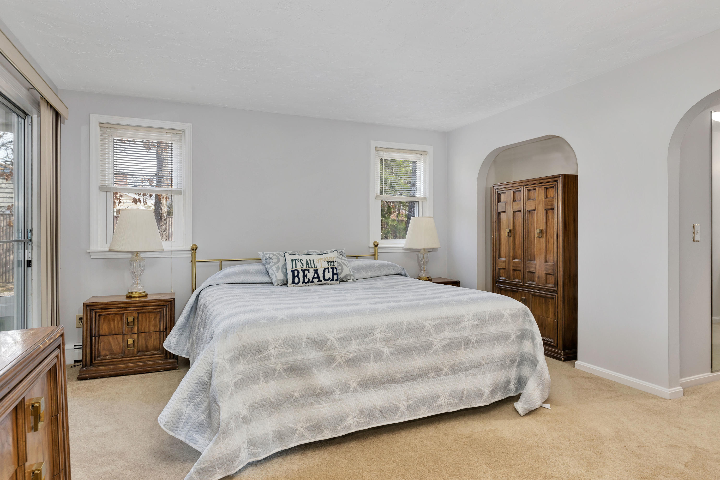 140 Thistle Drive Centerville, MA 02632 - Photo 28 of 46 a bedroom with a bed and painting on the wall