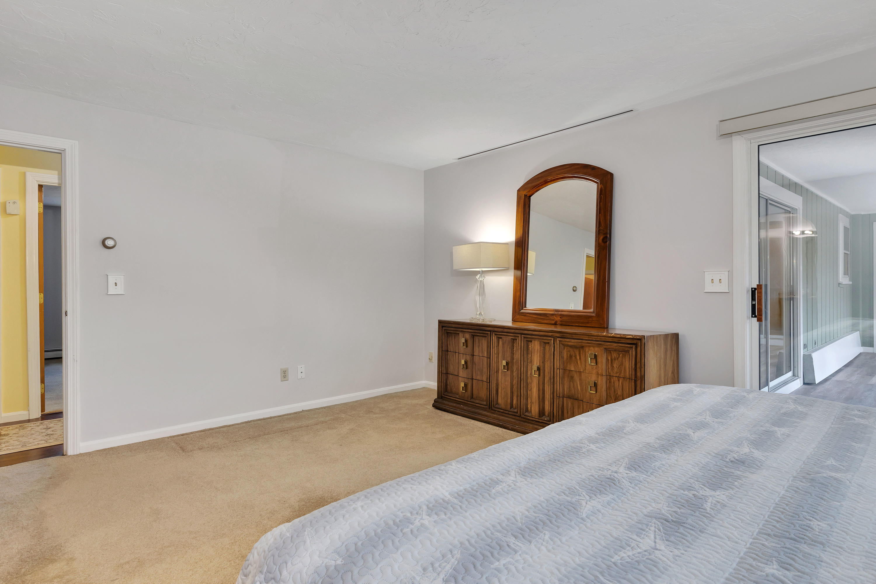 140 Thistle Drive Centerville, MA 02632 - Photo 29 of 46 a bedroom with a bed and a dresser