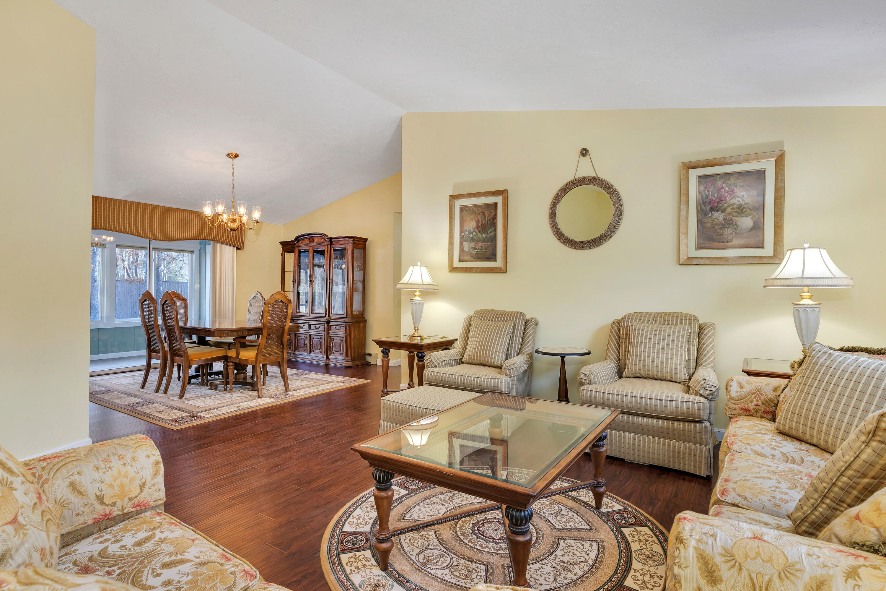 140 Thistle Drive Centerville, MA 02632 - Photo 3 of 46 a living room with furniture a dining table and a lamp