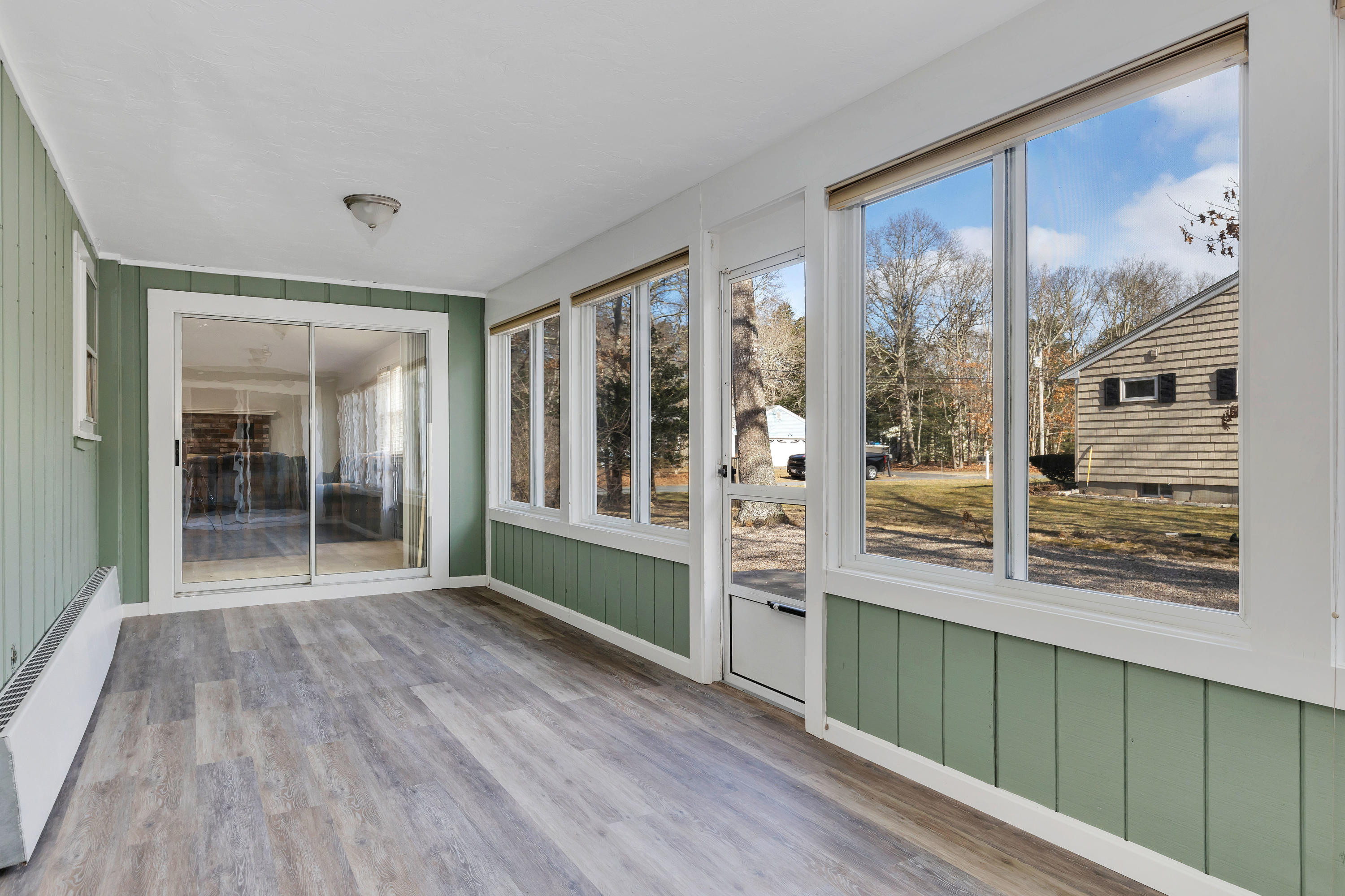 140 Thistle Drive Centerville, MA 02632 - Photo 33 of 46 a view of wooden floor and windows in a room