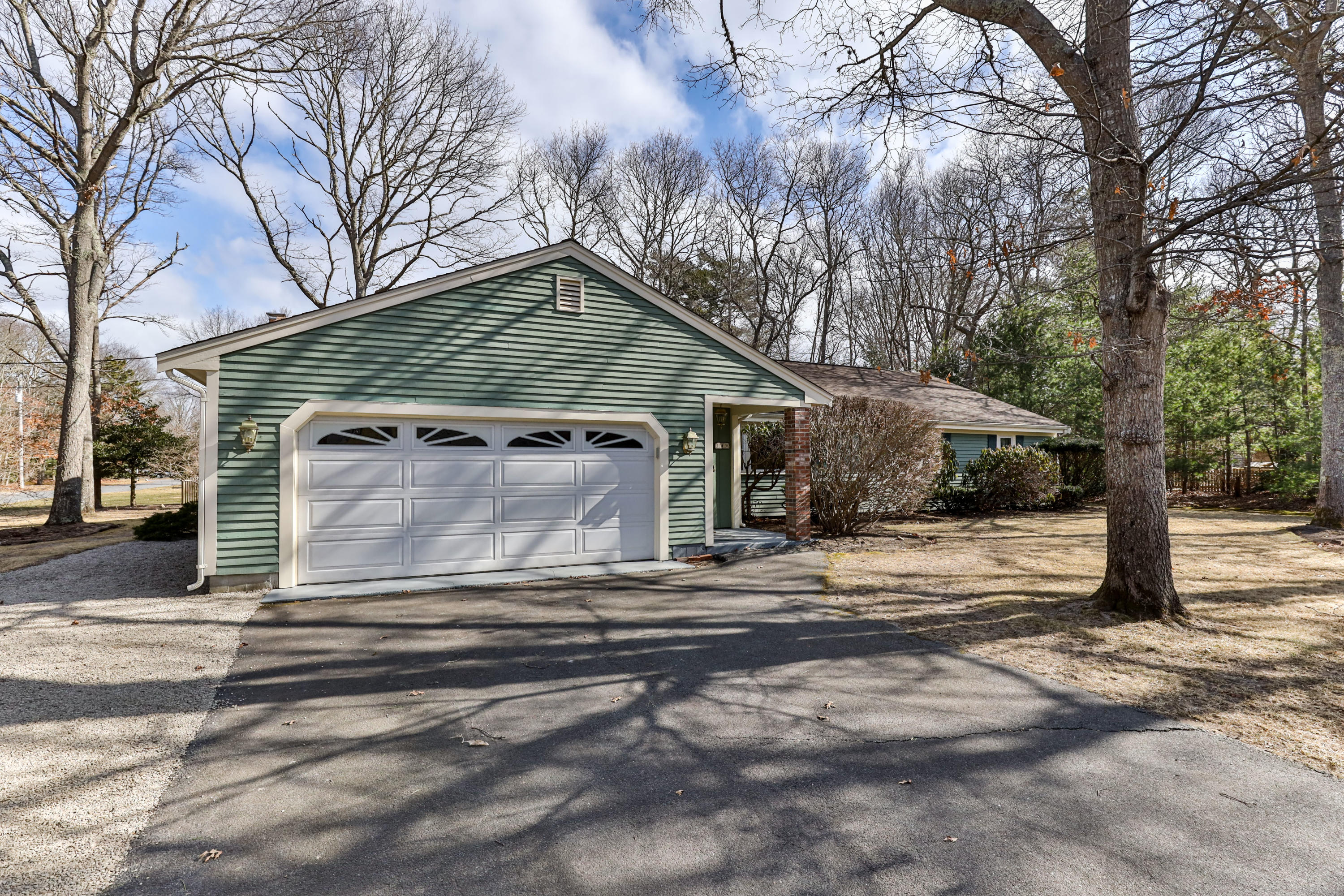 140 Thistle Drive Centerville, MA 02632 - Photo 43 of 46 a view of a house with a large tree