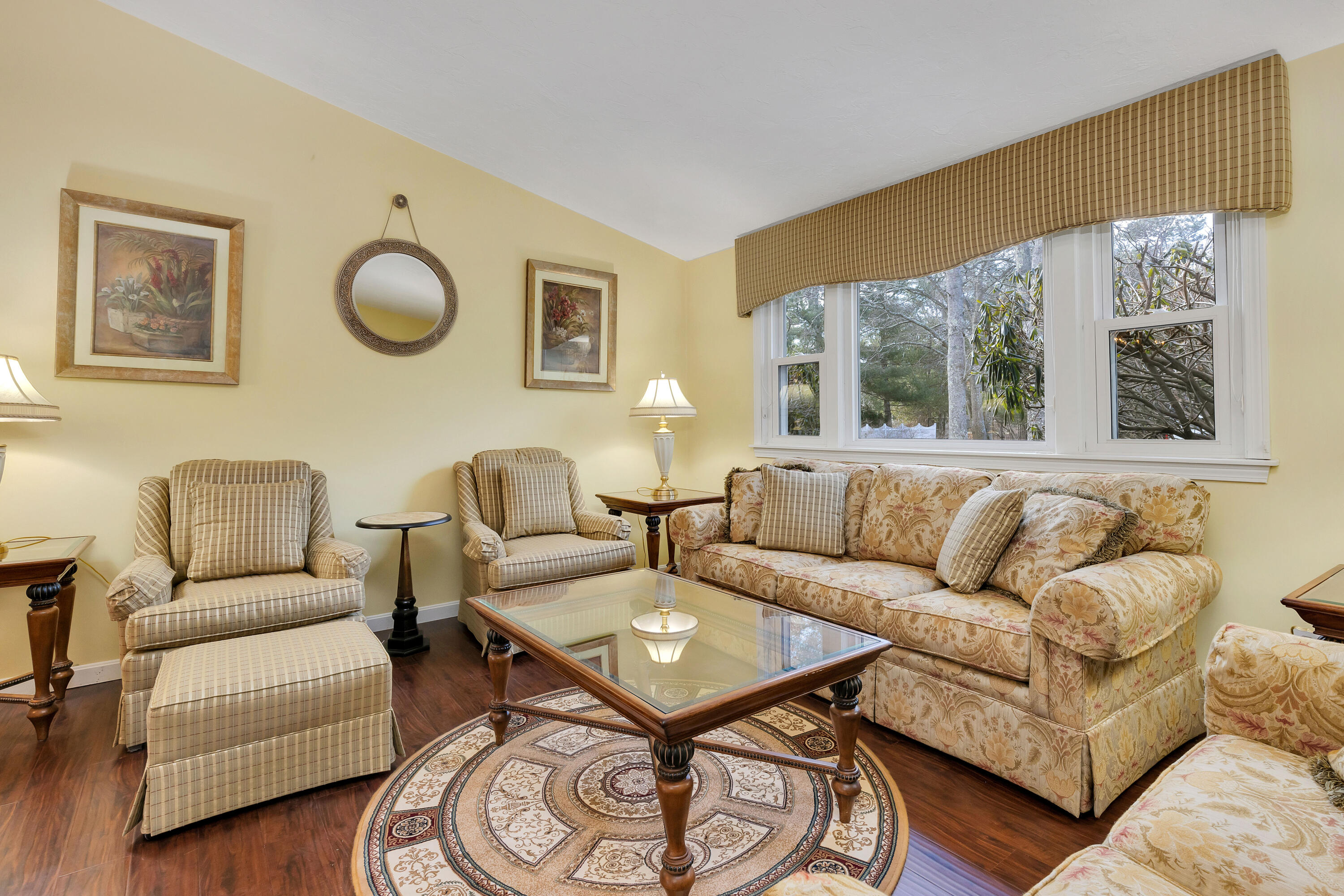 140 Thistle Drive Centerville, MA 02632 - Photo 7 of 46 a living room with furniture and a large window