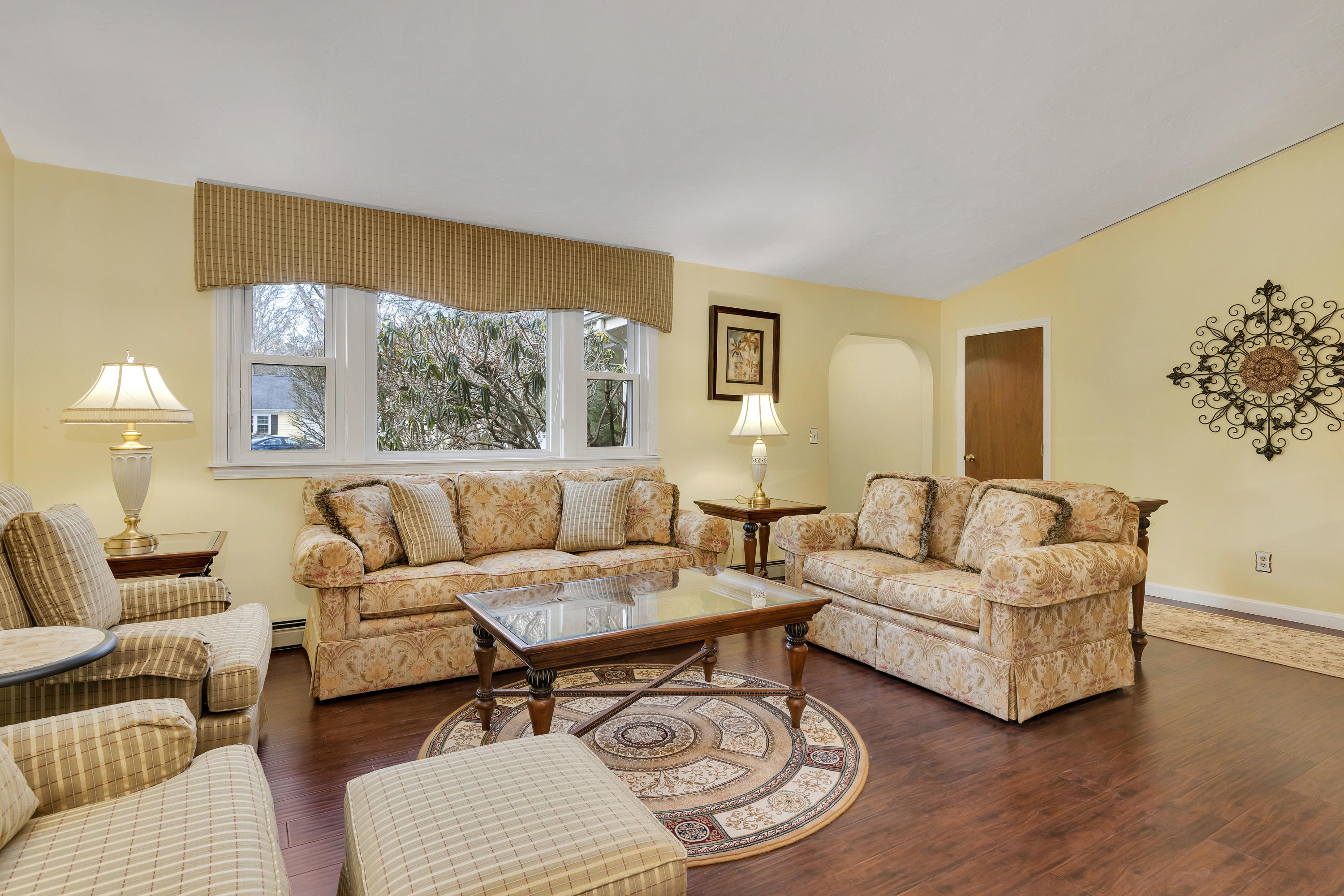 140 Thistle Drive Centerville, MA 02632 - Photo 8 of 46 a living room with furniture and a large window