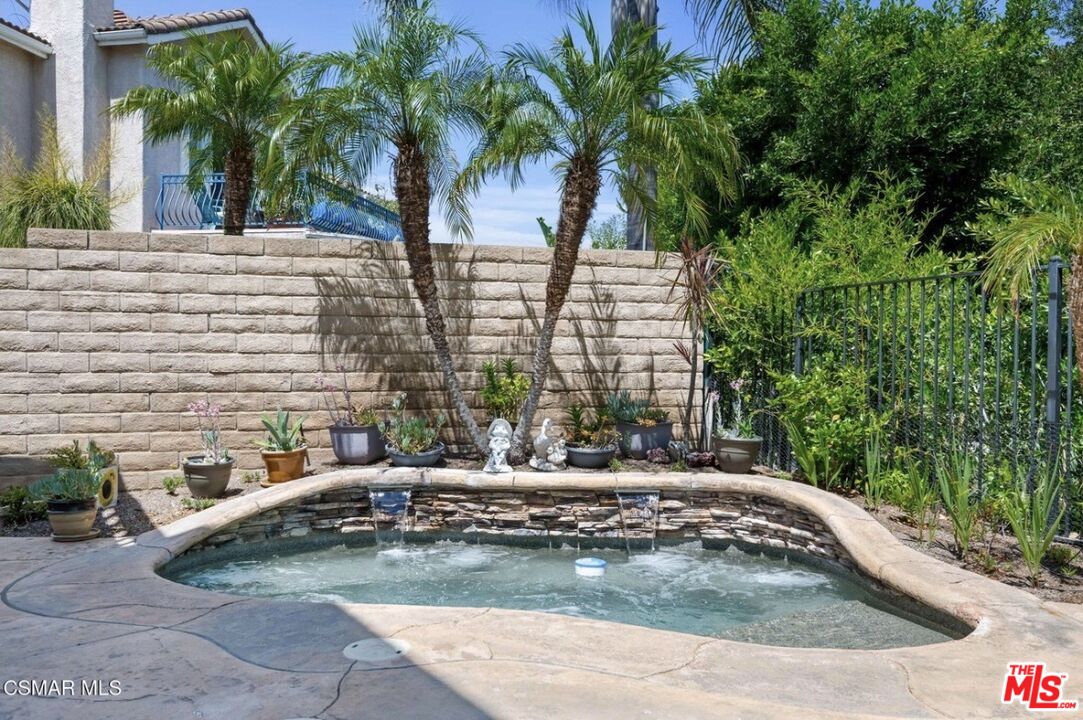 335 Kitetail Street Simi Valley, CA 93065 - Photo 16 of 37 a view of a backyard with swimming pool