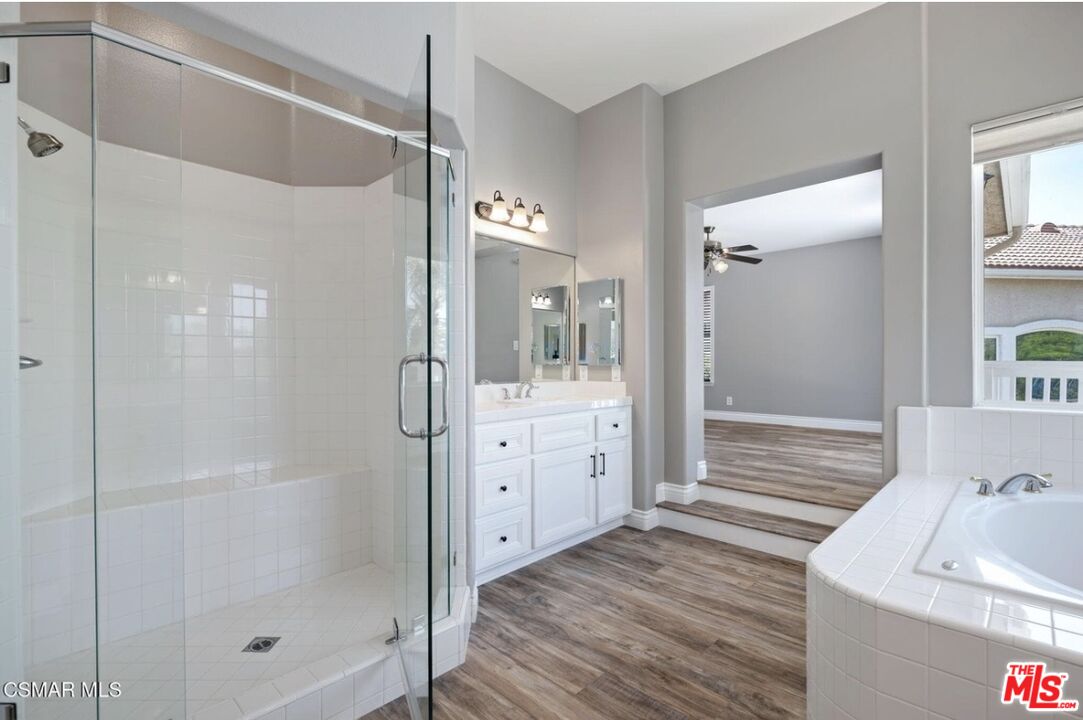 335 Kitetail Street Simi Valley, CA 93065 - Photo 20 of 37 a bathroom with a shower sink and mirror