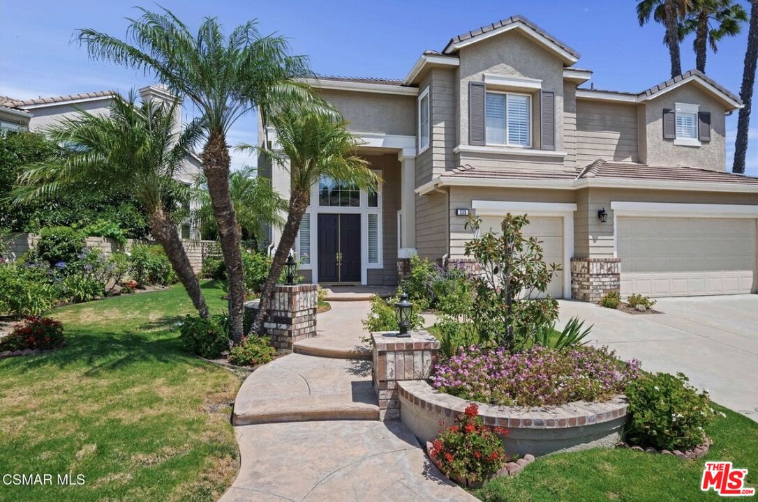 335 Kitetail Street Simi Valley, CA 93065 - Photo 2 of 37 a front view of a house with a yard