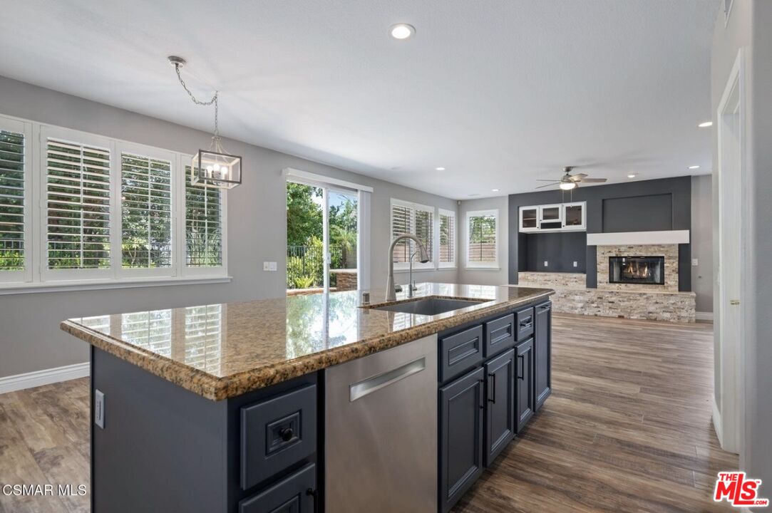 335 Kitetail Street Simi Valley, CA 93065 - Photo 7 of 37 a kitchen with granite countertop a stove and cabinets