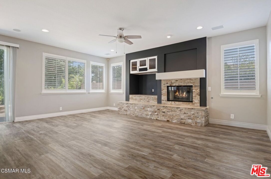 335 Kitetail Street Simi Valley, CA 93065 - Photo 8 of 37 a view of an empty room with a fireplace and a window