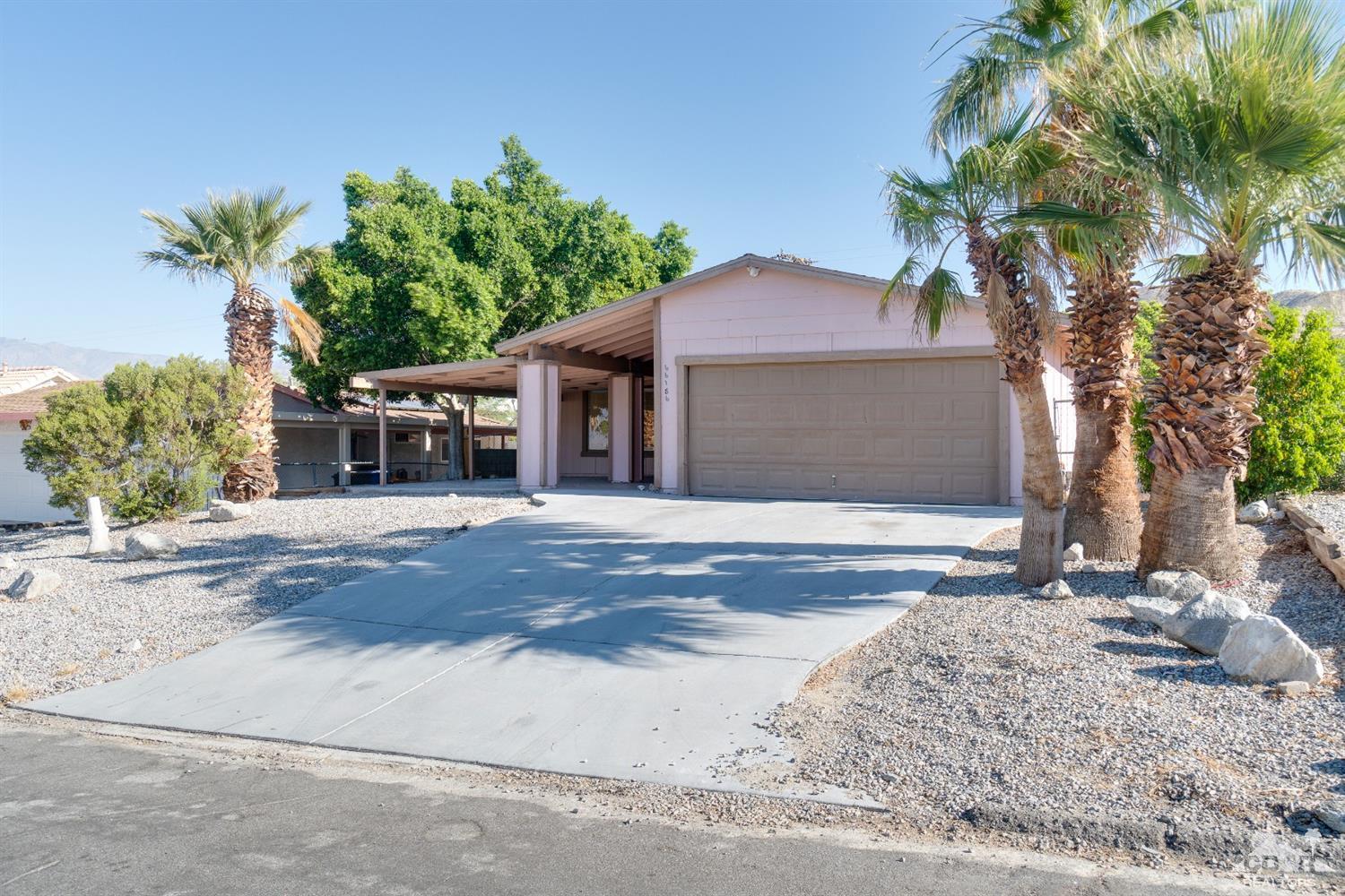 66186 Santa Rosa Road Desert Hot Springs, CA 92240 - Photo 1 of 23 front view of a house with a yard