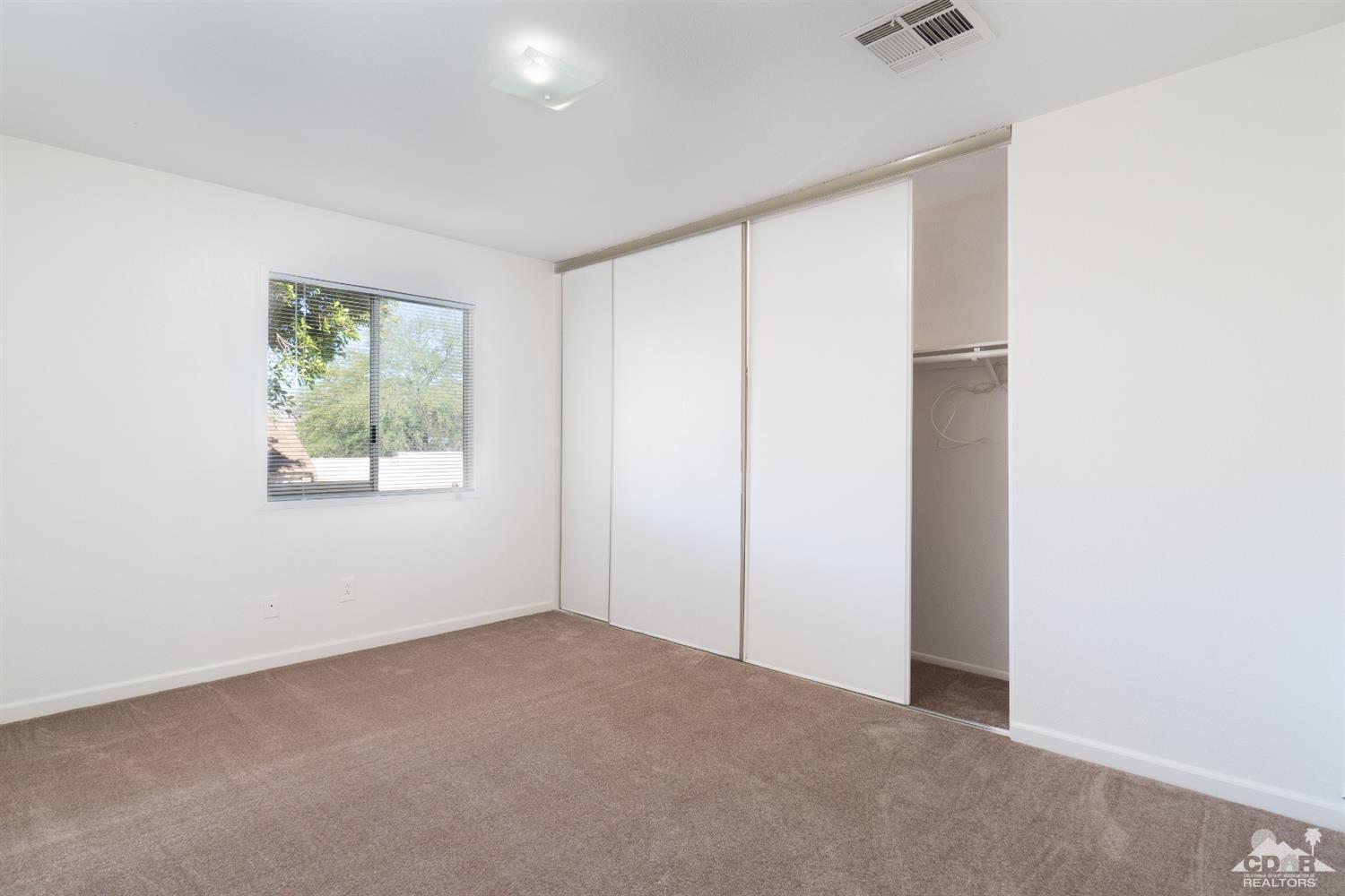 66186 Santa Rosa Road Desert Hot Springs, CA 92240 - Photo 15 of 23 an empty room with windows