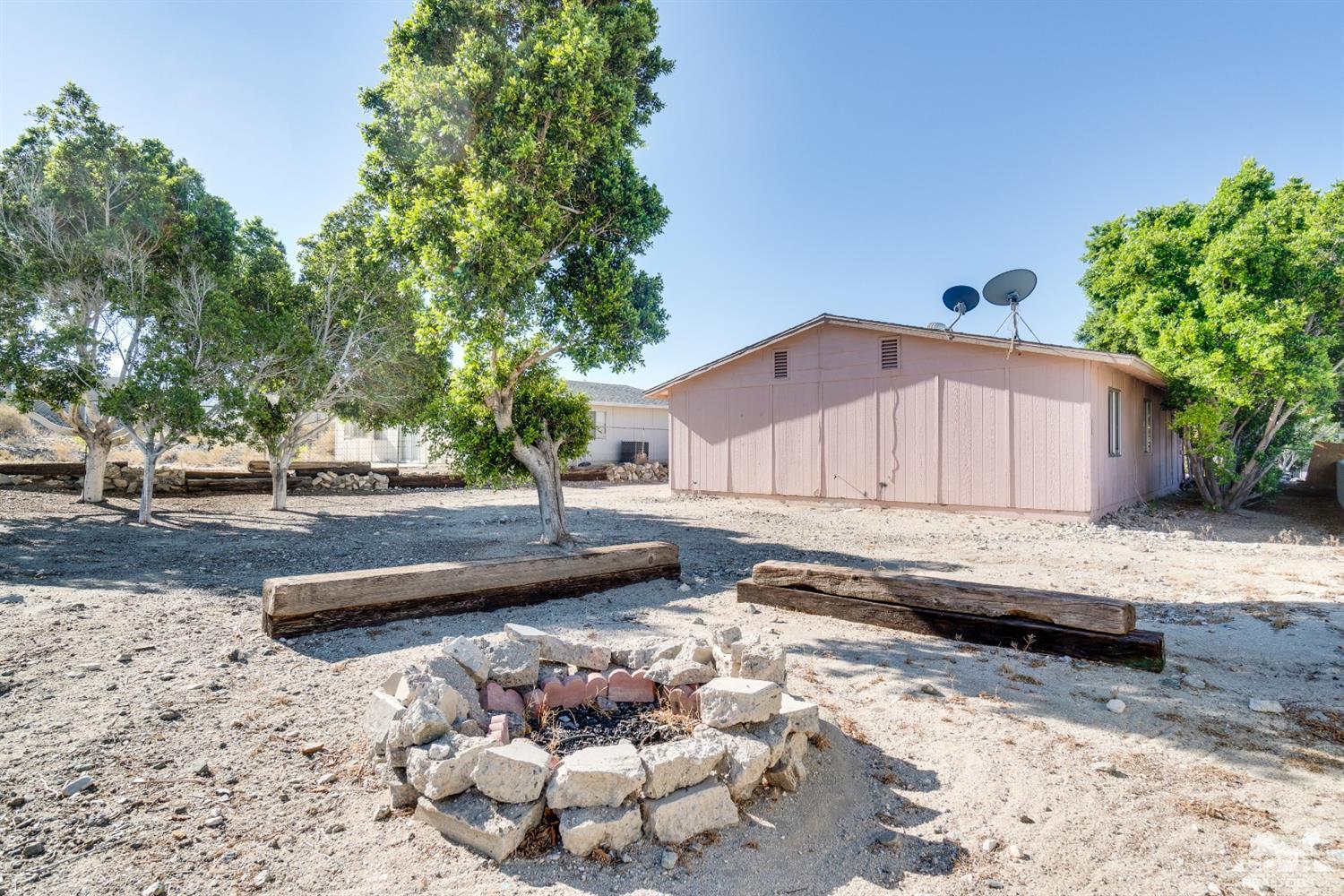 66186 Santa Rosa Road Desert Hot Springs, CA 92240 - Photo 21 of 23 a view of a backyard with a barbeque