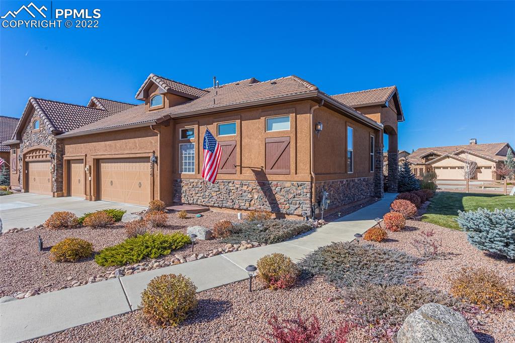 13214 Cake Bread Heights Colorado Springs, CO 80921 - Photo 1 of 28 a front view of a house with a yard