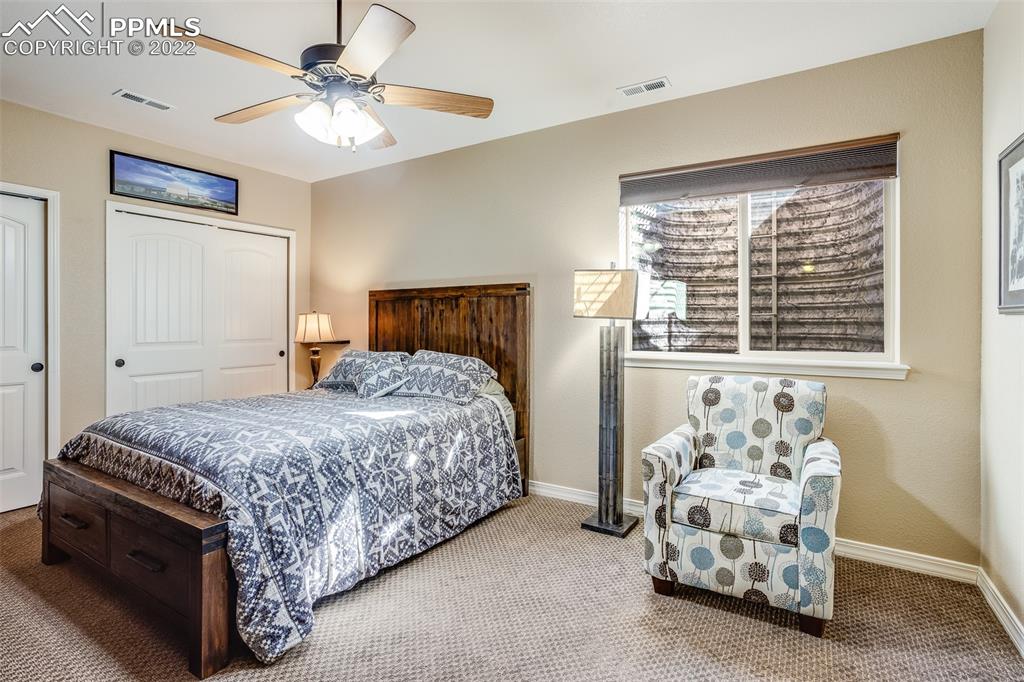 13214 Cake Bread Heights Colorado Springs, CO 80921 - Photo 23 of 28 a bedroom with a bed and a window