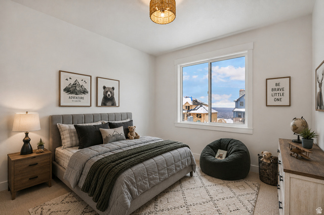 728 East Mountain Road North Ogden, UT 84414 - Photo 22 of 28 Bright bedroom featuring a large window, neutral wall tones, and overhead lighting