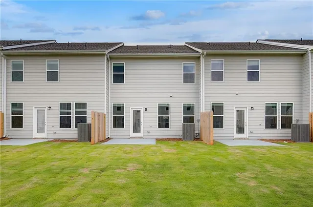 a house that has a big yard in front of it