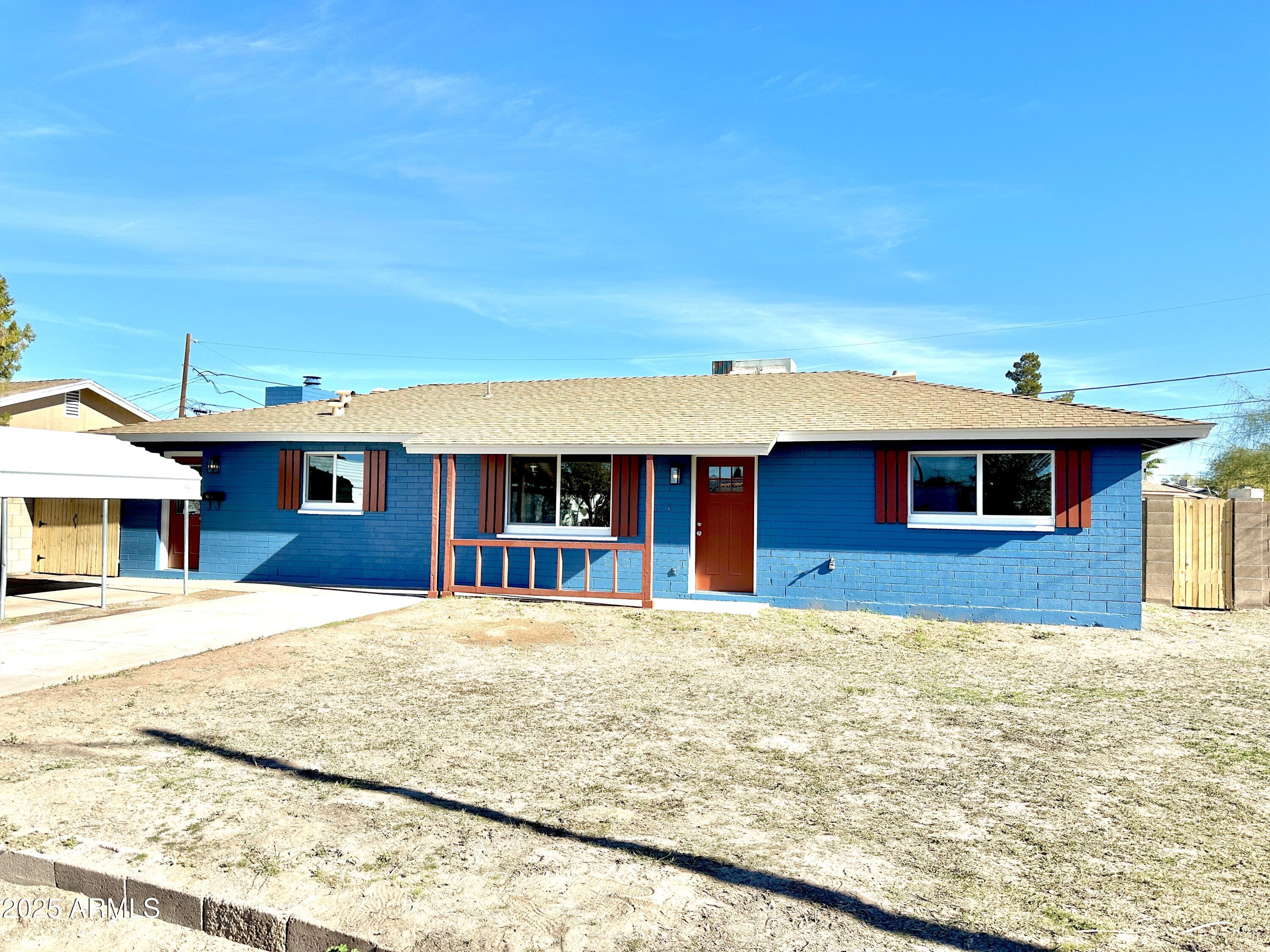 1188 North 4th Street Coolidge, AZ 85128 - Photo 1 of 26 a front view of a house with a yard