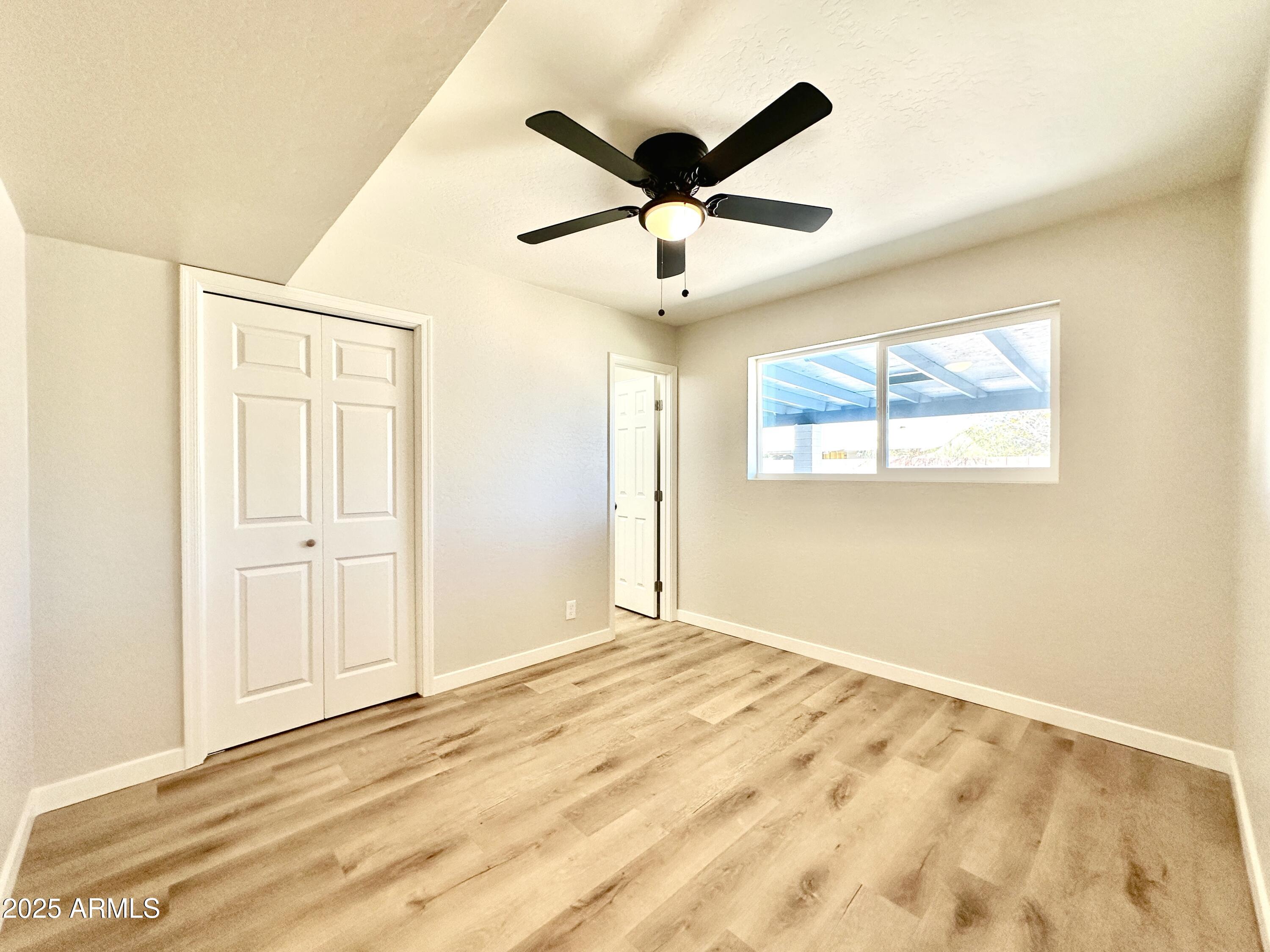 1188 North 4th Street Coolidge, AZ 85128 - Photo 12 of 26 a view of an empty room with a window