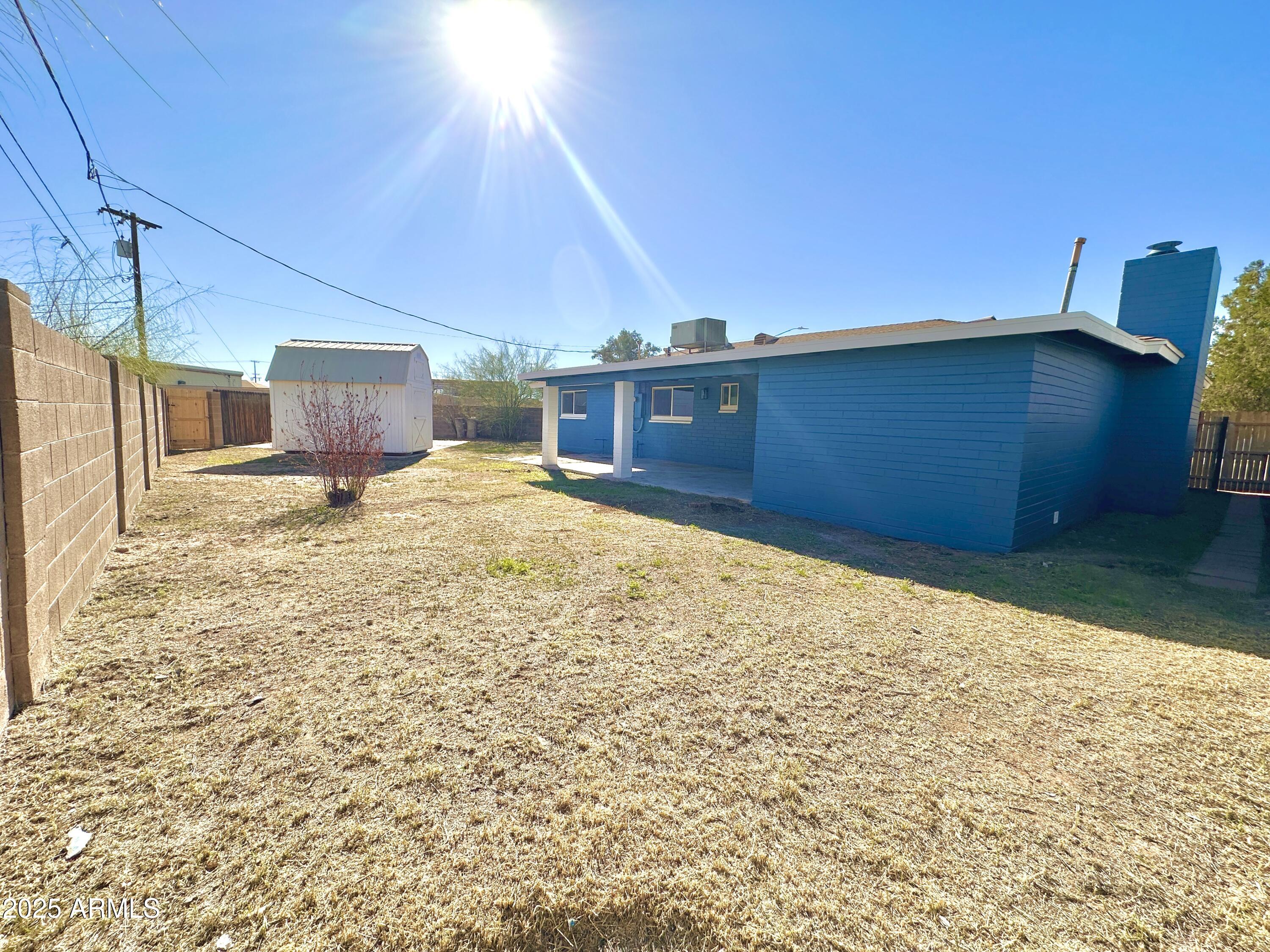 1188 North 4th Street Coolidge, AZ 85128 - Photo 19 of 26 a view of a backyard of the house