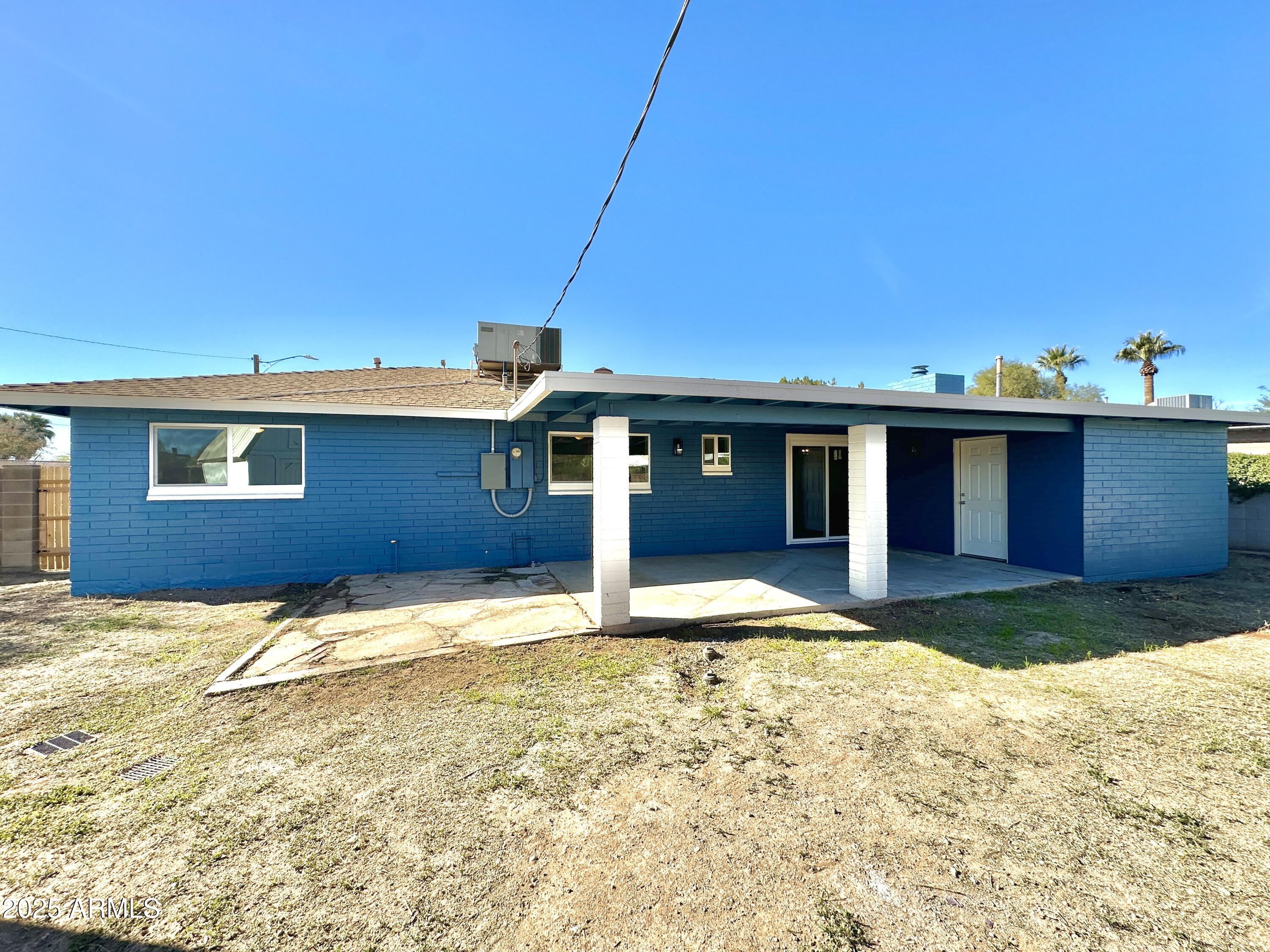 1188 North 4th Street Coolidge, AZ 85128 - Photo 21 of 26 a front view of a house with a yard
