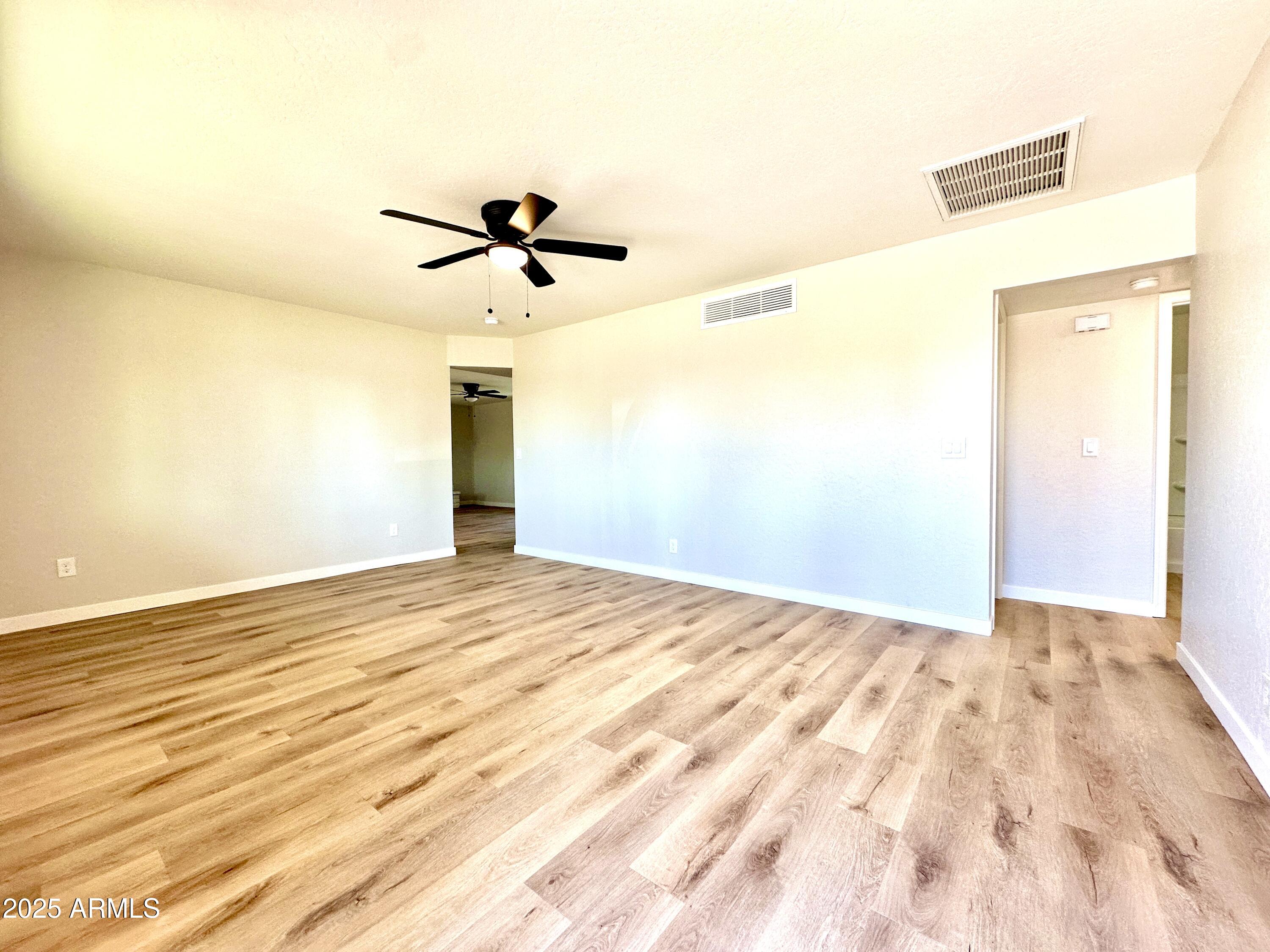 1188 North 4th Street Coolidge, AZ 85128 - Photo 25 of 26 a view of empty room with wooden floor