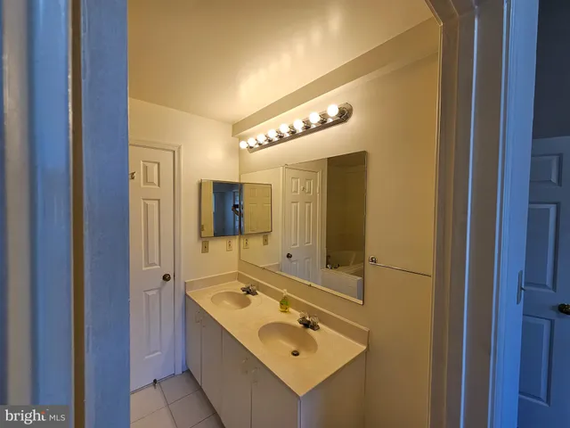 an empty room with wooden floor and closet