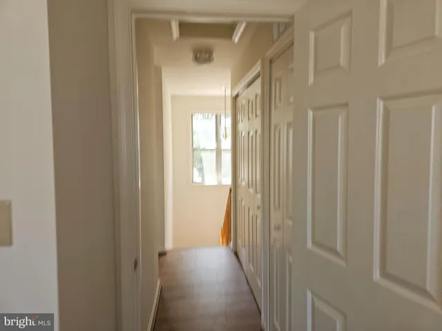 a view of a hallway with windows