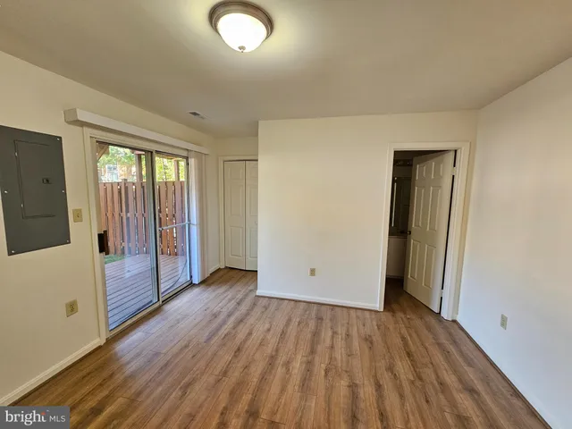 a view of a backyard with wooden fence