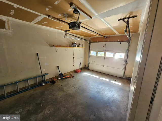 a view of a wooden door and a shower