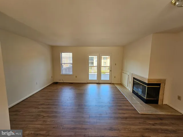 a view of a house with wooden deck
