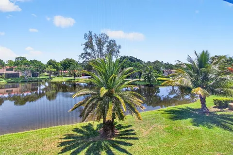 a view of a house with a yard and plants