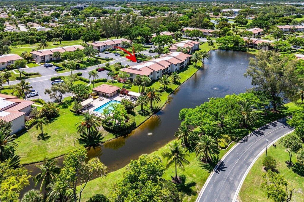 9283 Vista Del Lago, Unit 37J Boca Raton, FL 33428 - Photo 17 of 19 an aerial view of a house with a garden and lake view