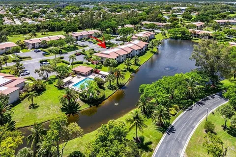 an aerial view of a houses with a lake view