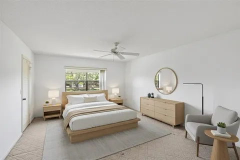 a bedroom with bed and a window