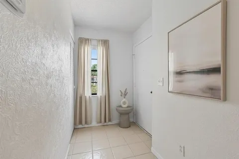 a bathroom with a granite countertop shower and a toilet