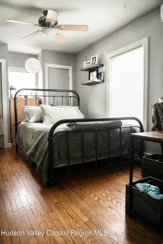 a bedroom with a bed and a cabinets