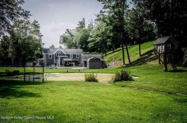 a view of house with a big yard