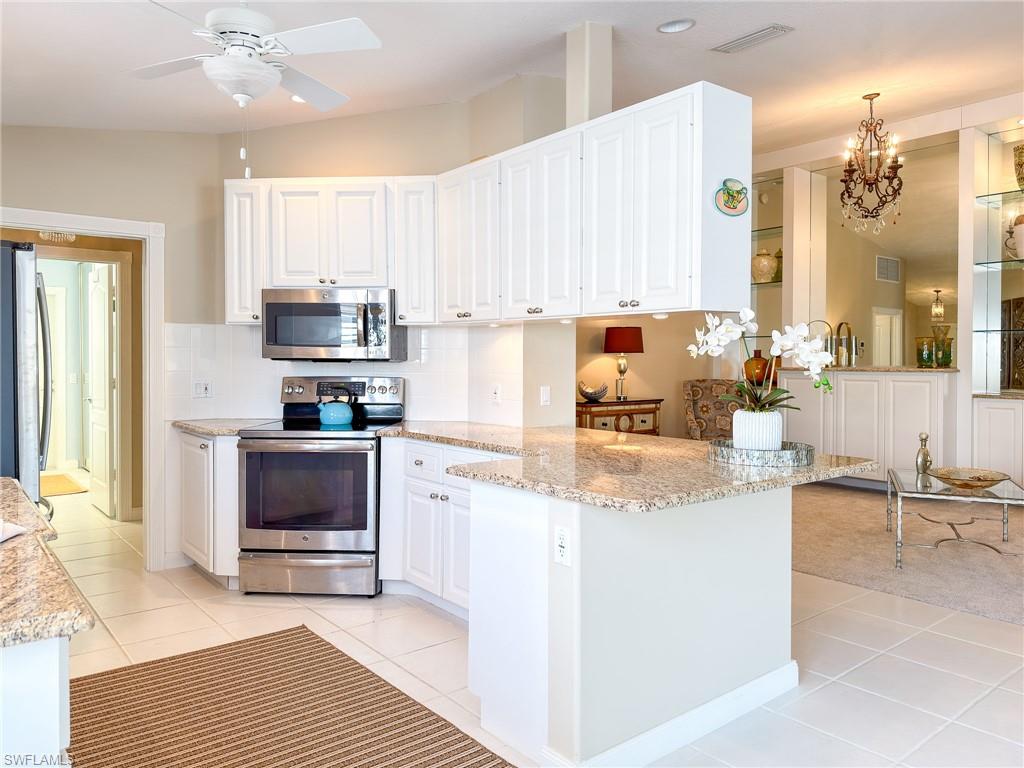 3356 Cayman Lane Naples, FL 34119 - Photo 13 of 42 This kitchen design offers ideal storage space