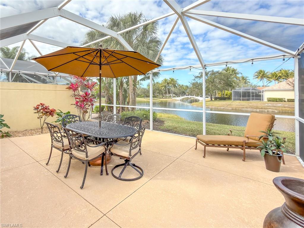 3356 Cayman Lane Naples, FL 34119 - Photo 32 of 46 Covered Lanai overlooks one of the many iconic bridges