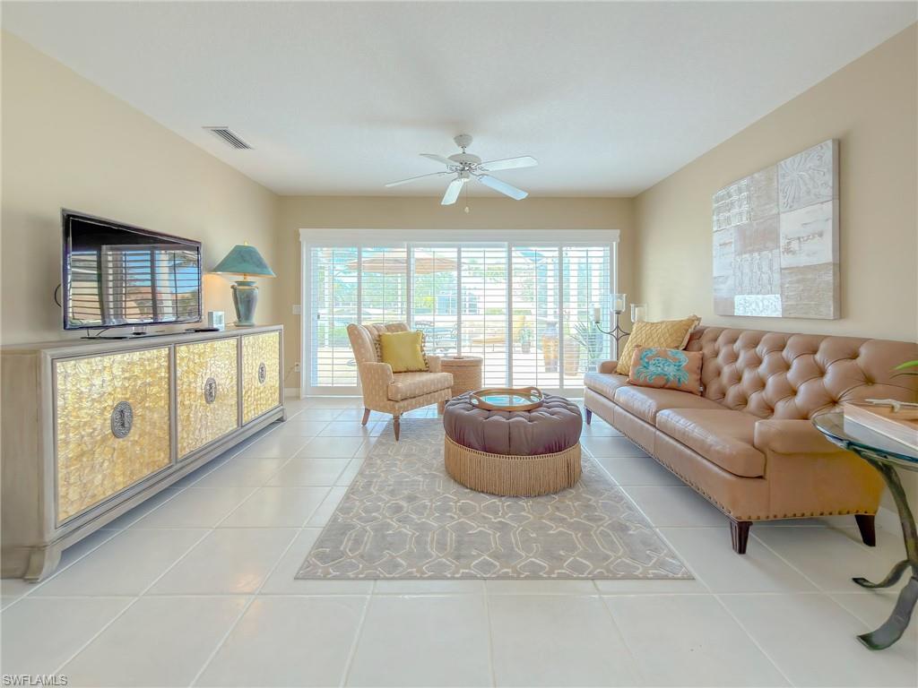 3356 Cayman Lane Naples, FL 34119 - Photo 6 of 42 A more casual seating - football game anyone?